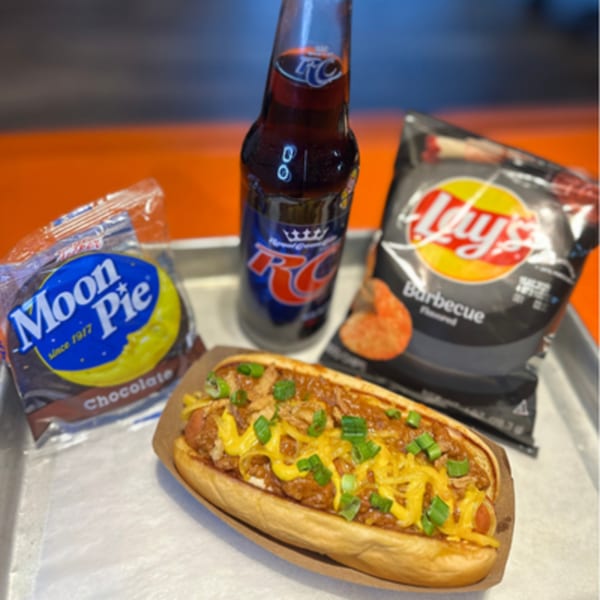 A Hi Five Hotdog with chili, cheese, and green onions, served with chips, a Moon Pie, and RC Cola.