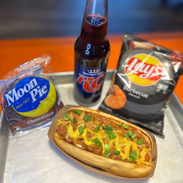 A Hi Five Hotdog with chili, cheese, and onions, with a Moon Pie, chips, and soda.
