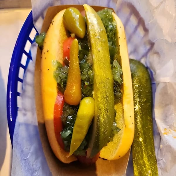 Hi Five Hotdogs' hot dog with relish, pickles, and peppers in a blue basket.